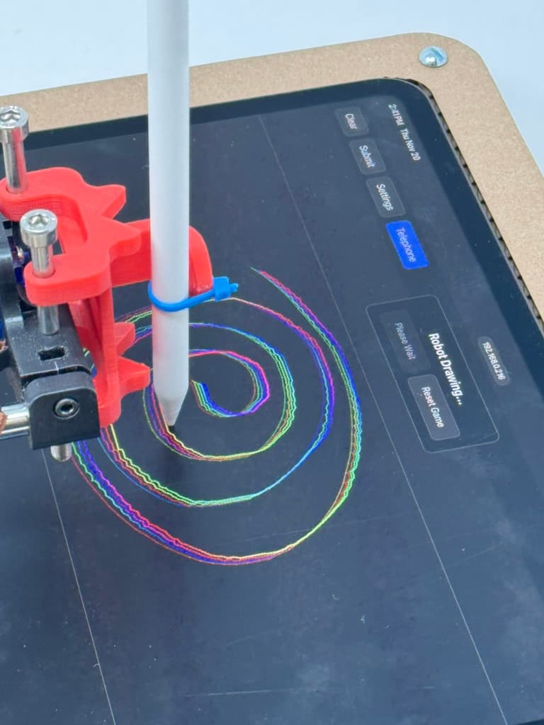 Close-up of the Apple Pencil end effector drawing a spiral on an iPad